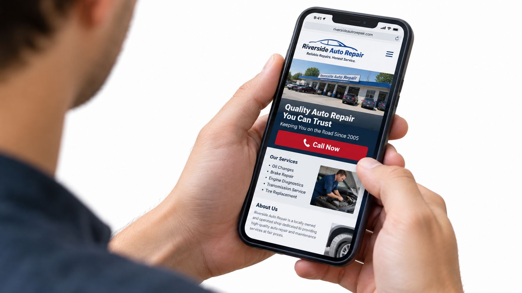 A person holding a smartphone displaying the Riverside Auto Repair website featuring services and contact information.